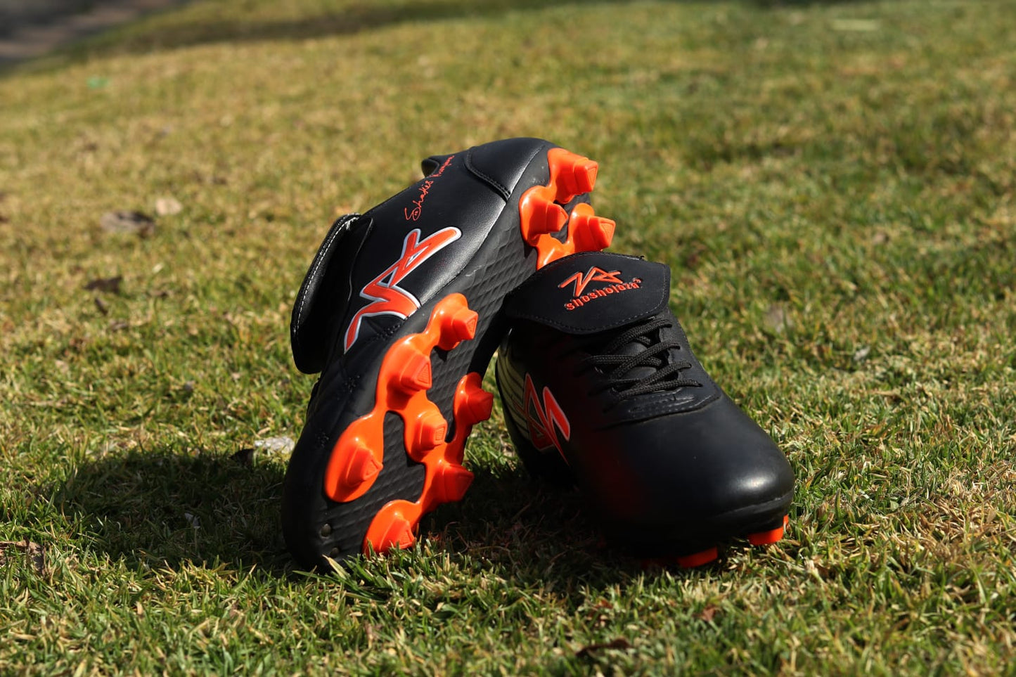 Shosholoza Shakes Kungwane Black and Orange Soccer Boot